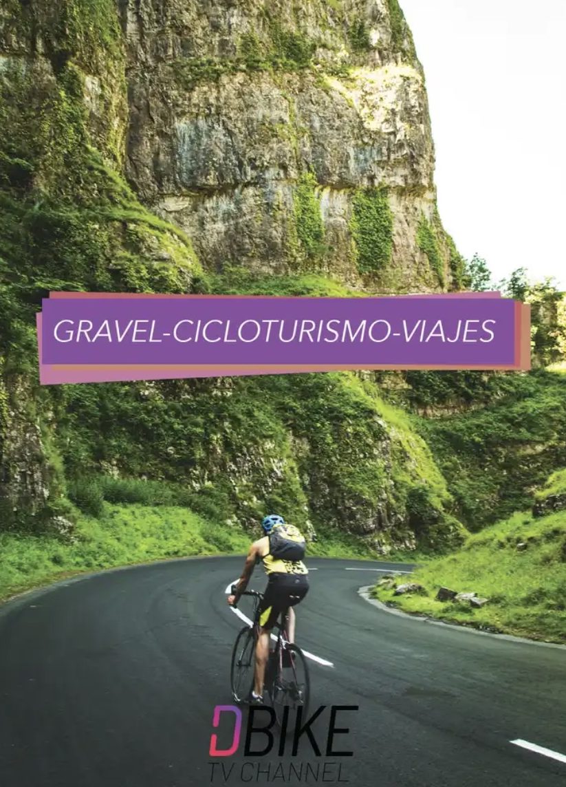 Gravel, cicloturismo y viajes: ciclista en una carretera entre paredes de roca